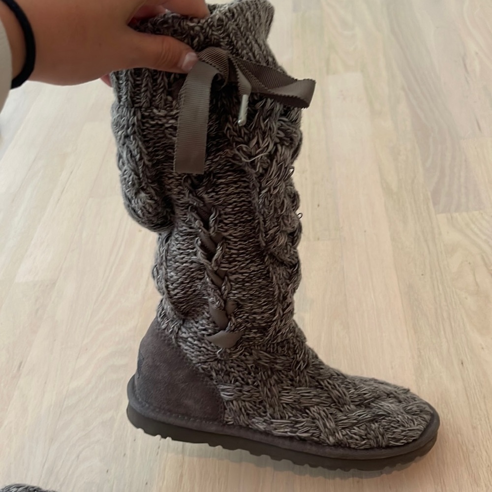 Gray lace up sweater UGG boots.